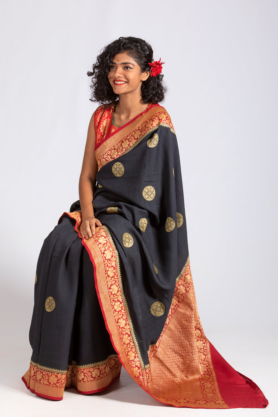 Kumkum - Black silk saree with Red border